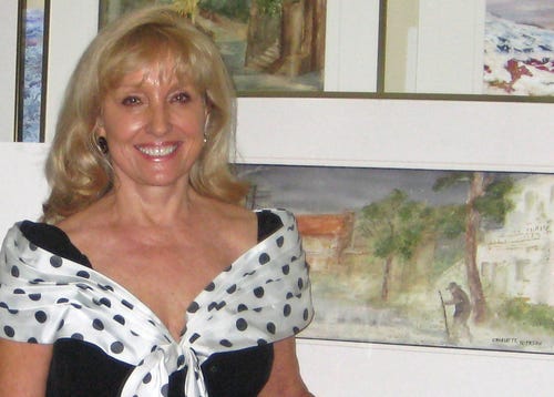 Charlotte Bailey Rierson standing beside a sculpture